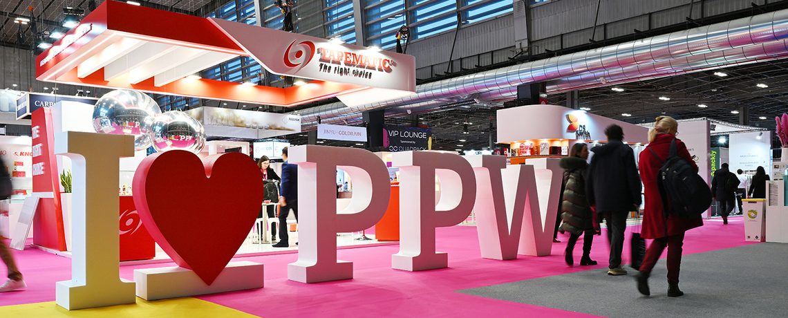 Visitors at the "I love PPW" installation on the Paris Packaging Week show floor